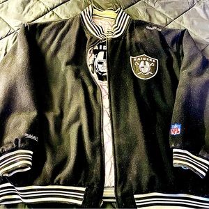 Mens Raiders Reversible NFL Sports winter jacket.  Color is black/white/silver